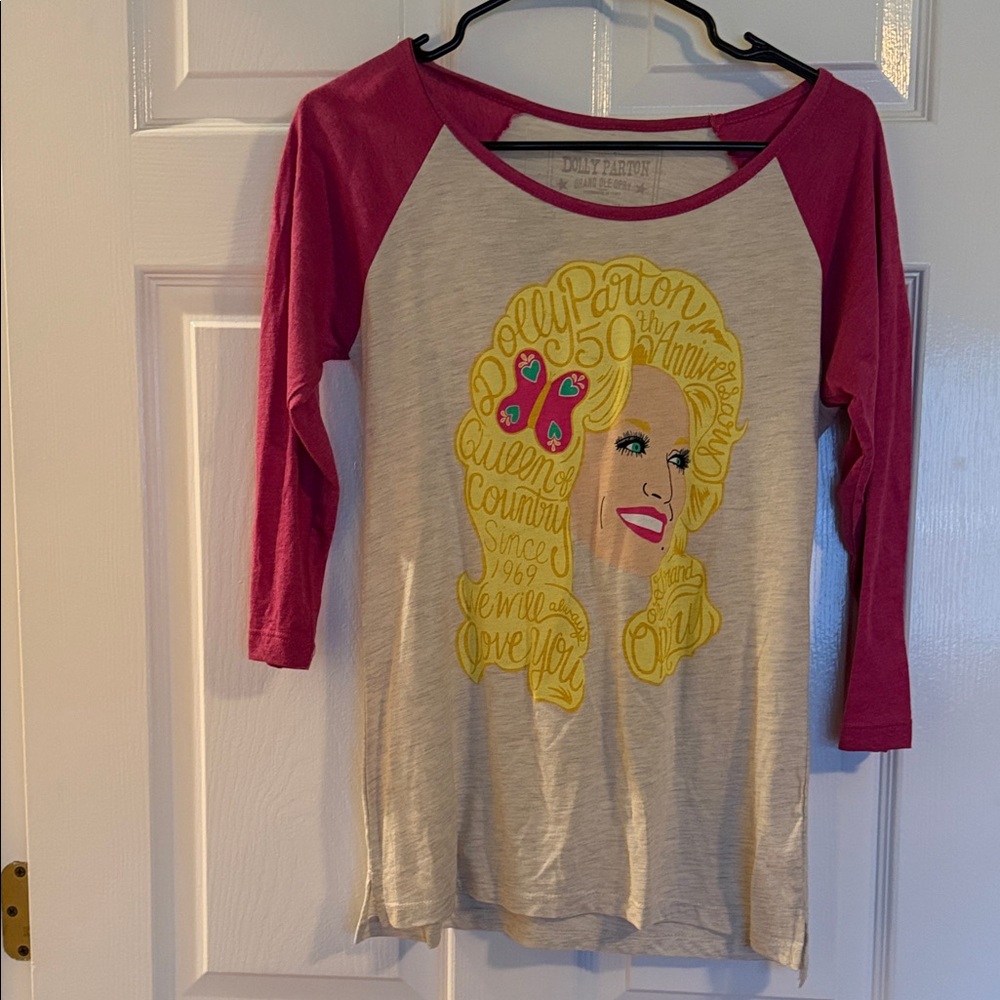 Dolly Parton Women’s Tee Shirt w/ quarter length sleeves.